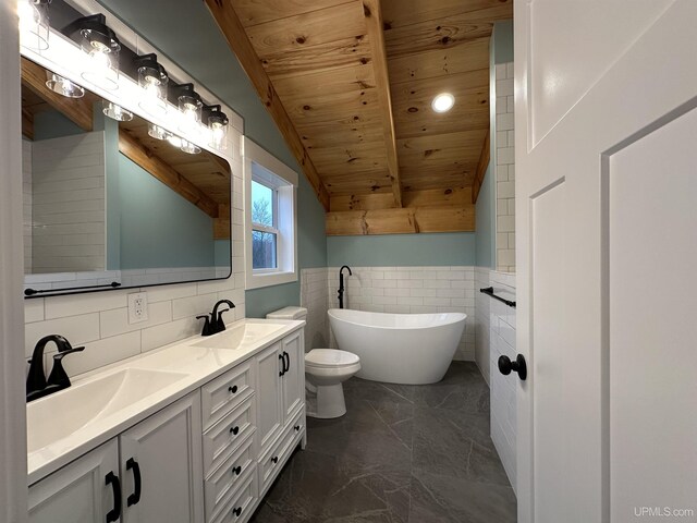 11881 N Junet Rd, Ironwood, MI 49938 - bathroom with tile walls, marble tiled floors, lofted ceiling, a freestanding tub, and wood ceiling