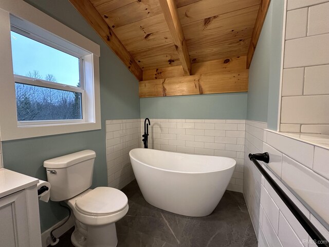 11881 N Junet Rd, Ironwood, MI 49938 - bathroom featuring wooden ceiling, vanity, toilet, a soaking tub, and beam ceiling