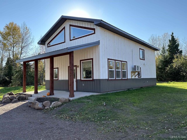 11881 N Junet Rd, Ironwood, MI 49938 - view of front of home featuring a front lawn and a patio area