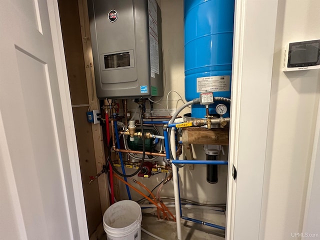 utility room featuring tankless water heater