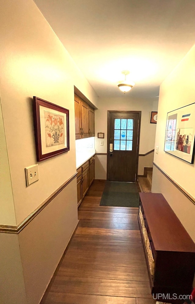 doorway to outside featuring dark hardwood / wood-style flooring