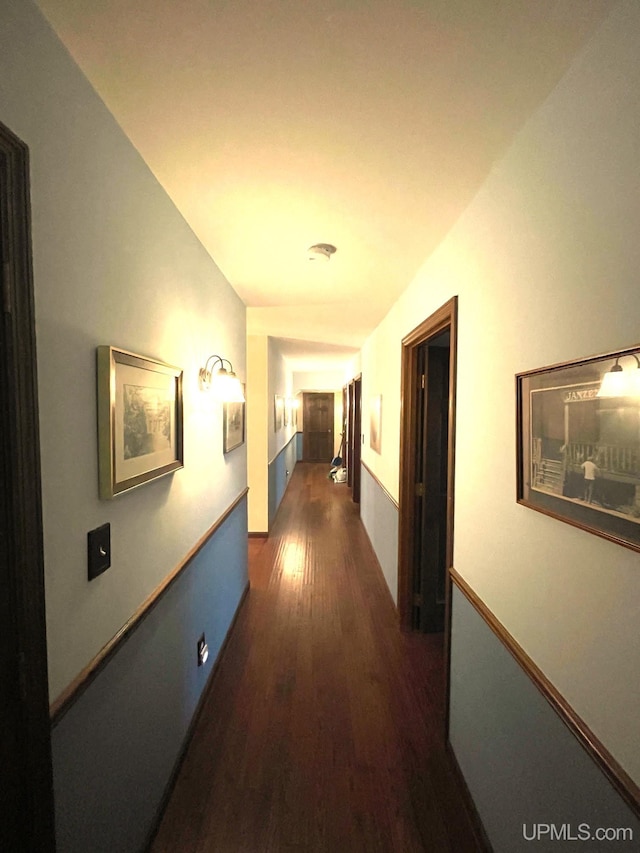 hallway with dark wood-type flooring