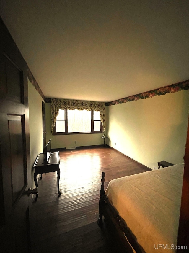 bedroom featuring wood-type flooring