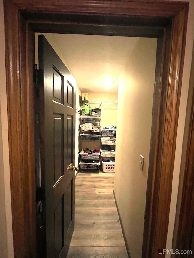 hallway with wood-type flooring