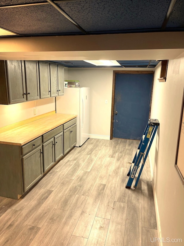 basement featuring light hardwood / wood-style floors