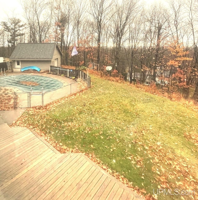 view of yard featuring a patio and a pool side deck