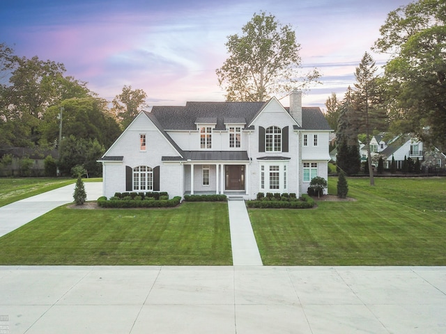 view of front of property with a yard