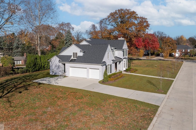 view of home's exterior with a garage and a yard