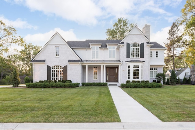 french country home with a front yard