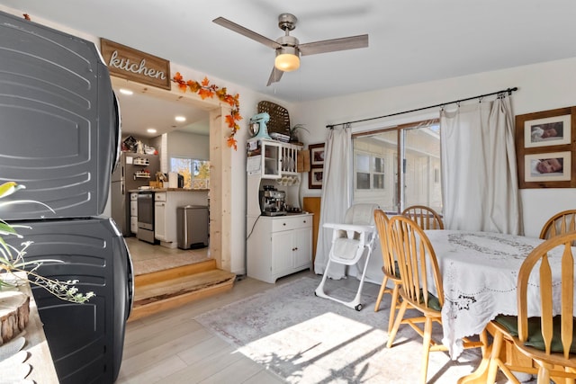 dining area with light hardwood / wood-style flooring, ceiling fan, and plenty of natural light