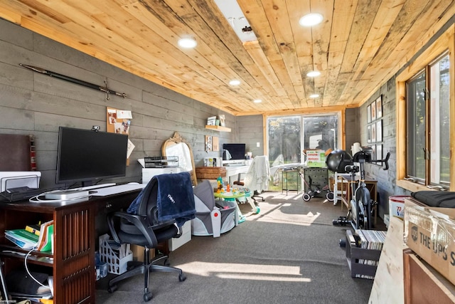 carpeted office with wooden ceiling and wooden walls