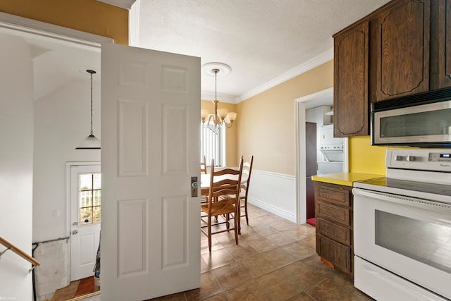 kitchen with white electric range oven, an inviting chandelier, hanging light fixtures, crown molding, and dark brown cabinets