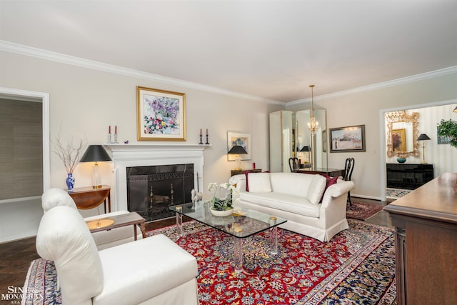 living room featuring hardwood / wood-style flooring, a notable chandelier, and ornamental molding