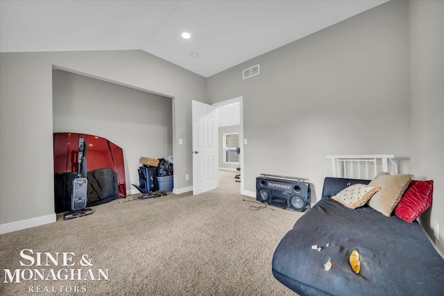 interior space featuring vaulted ceiling and carpet floors