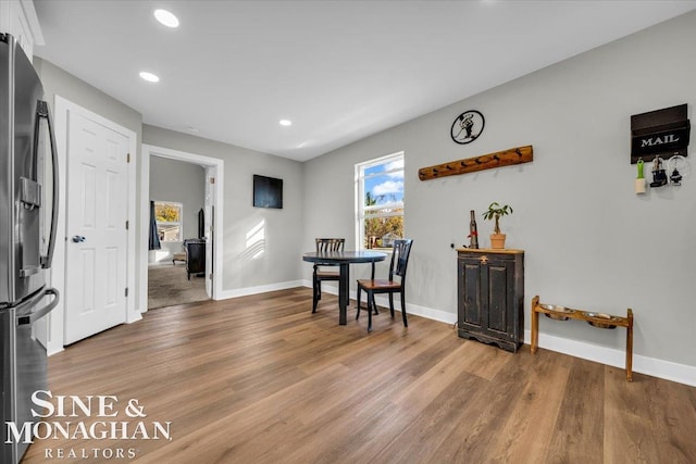 dining space with hardwood / wood-style flooring