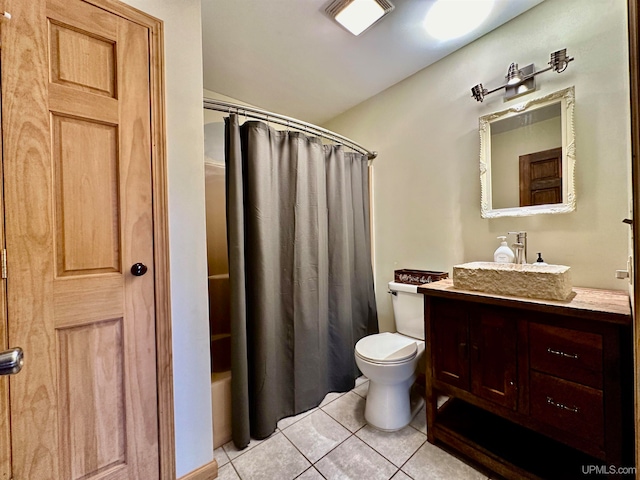 full bathroom with tile patterned floors, vanity, toilet, and shower / tub combo with curtain