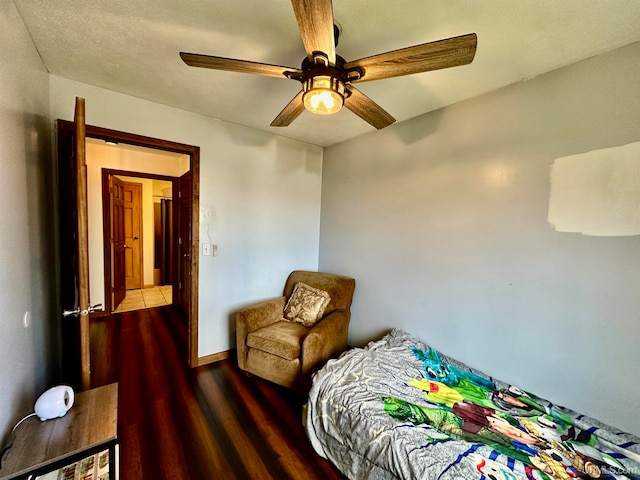 bedroom featuring ceiling fan and wood-type flooring