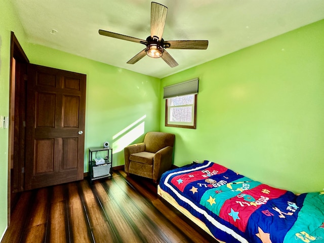 bedroom featuring ceiling fan and dark hardwood / wood-style floors