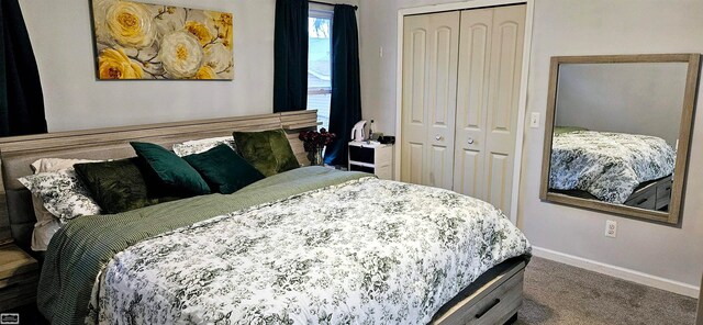 bedroom with carpet and a closet