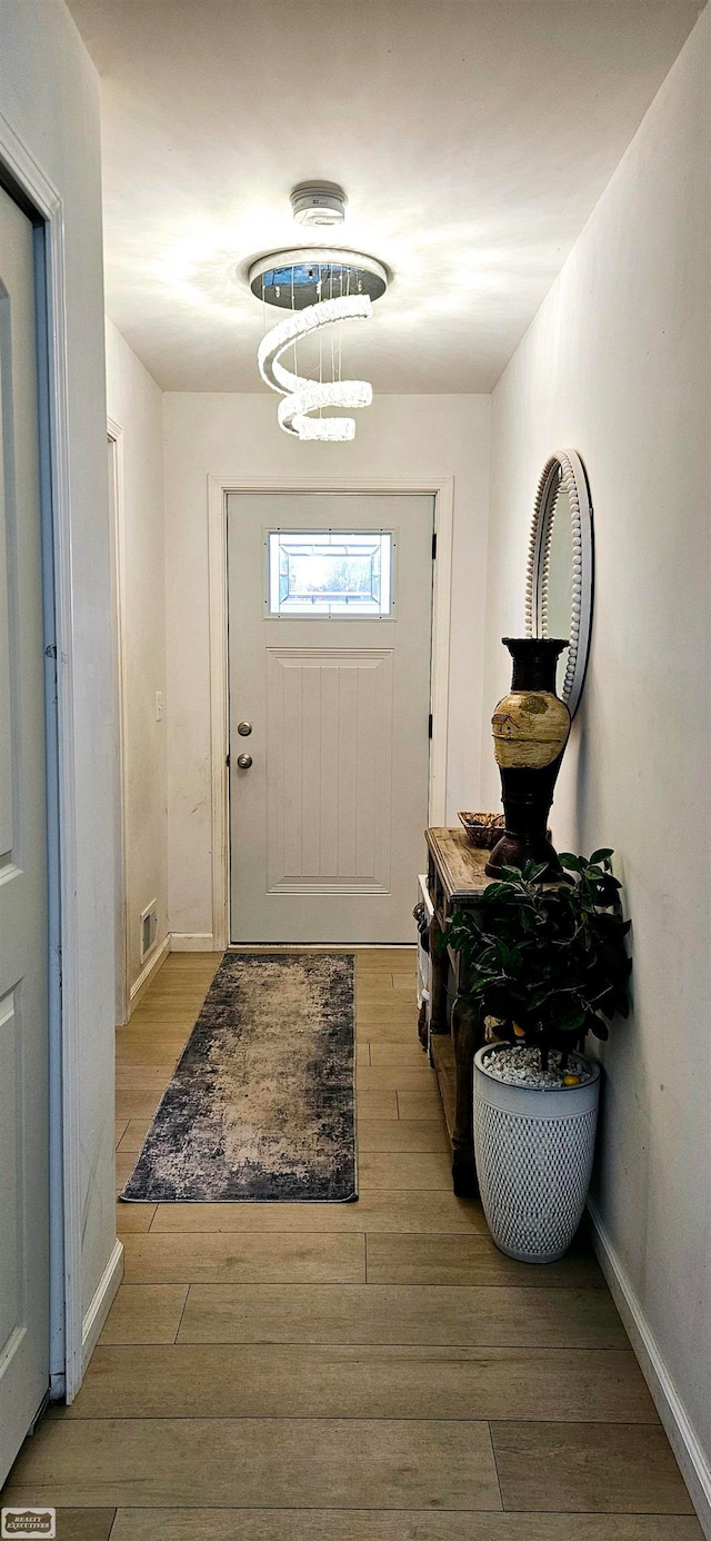 entryway with light hardwood / wood-style flooring