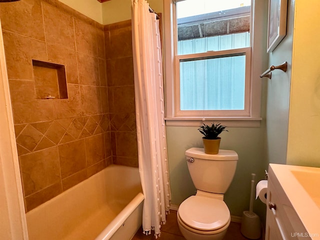 full bathroom featuring toilet, vanity, and shower / bath combination with curtain