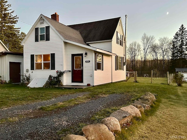 view of front of property with a front lawn