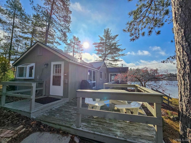 exterior space featuring a wooden deck