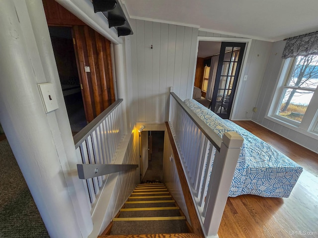 stairway with wood finished floors