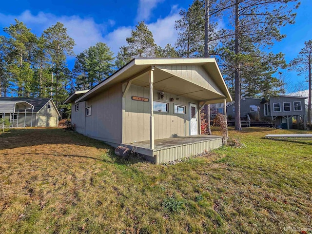 rear view of property featuring a yard