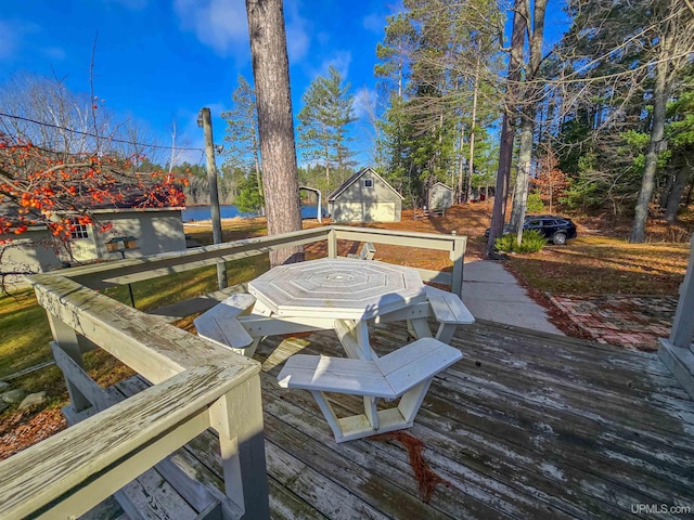 wooden terrace featuring outdoor dining area