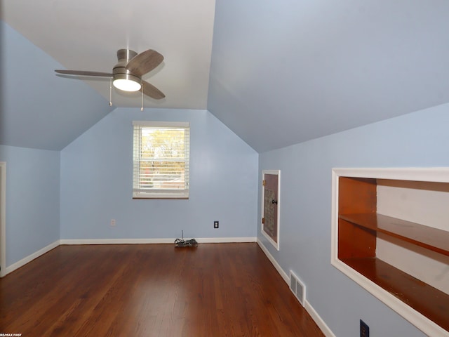 bonus room with dark wood-type flooring, ceiling fan, and lofted ceiling