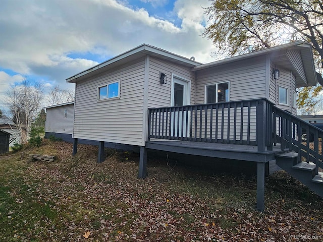 view of side of property featuring a deck