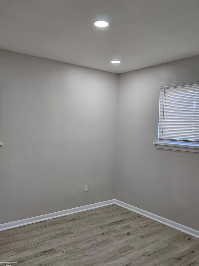 unfurnished room with light hardwood / wood-style floors