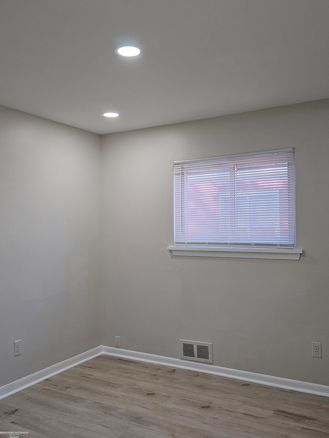 unfurnished room featuring light wood-type flooring