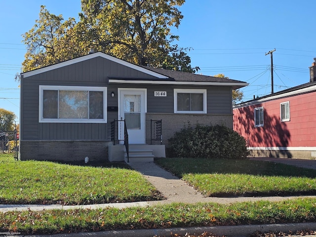 view of front of home with a front yard