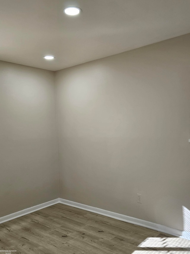 spare room featuring hardwood / wood-style floors