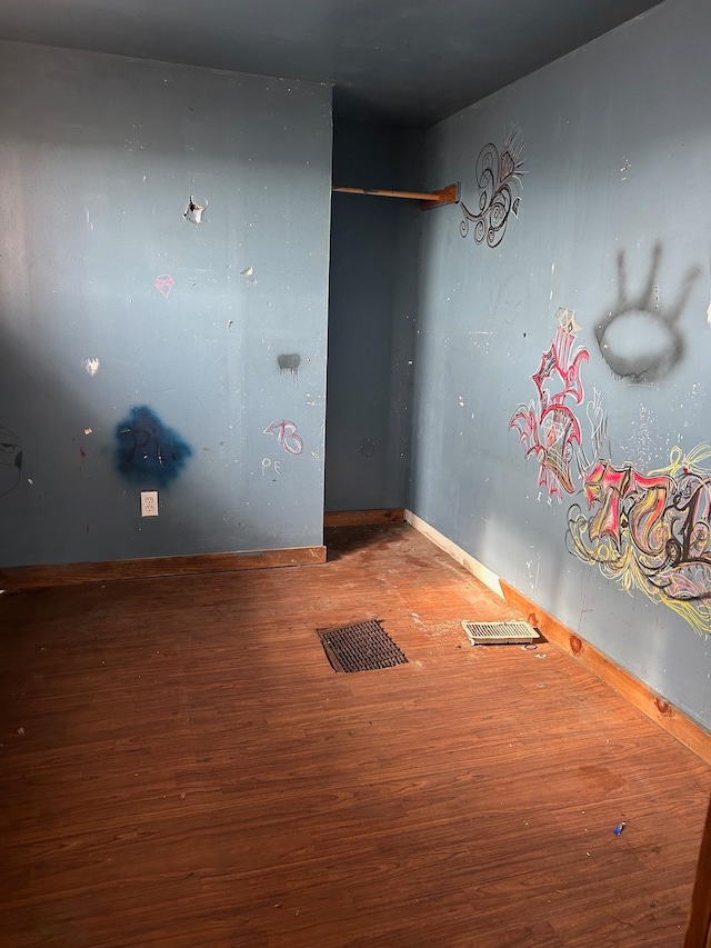 spare room featuring hardwood / wood-style flooring