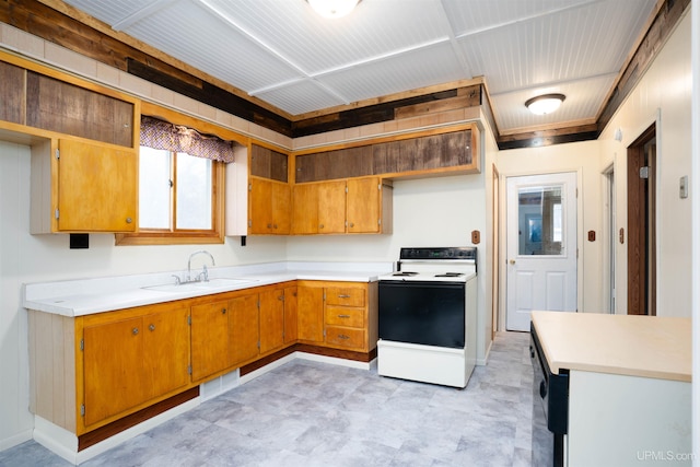 kitchen featuring white electric stove and sink