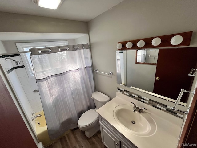 full bathroom featuring toilet, vanity, shower / bath combination with curtain, and wood-type flooring