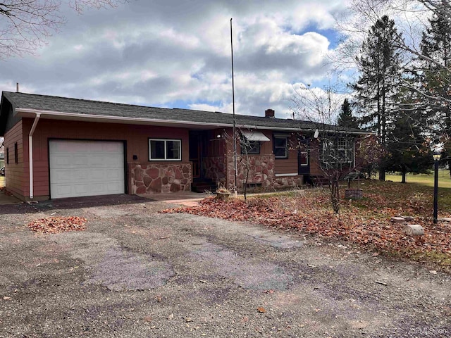 single story home with a garage