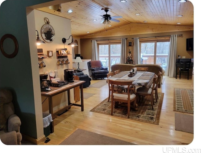 dining space with light wood-type flooring, vaulted ceiling, wooden ceiling, and ceiling fan