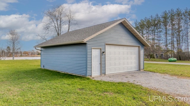 garage featuring a yard