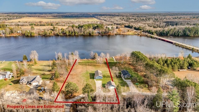 birds eye view of property with a water view