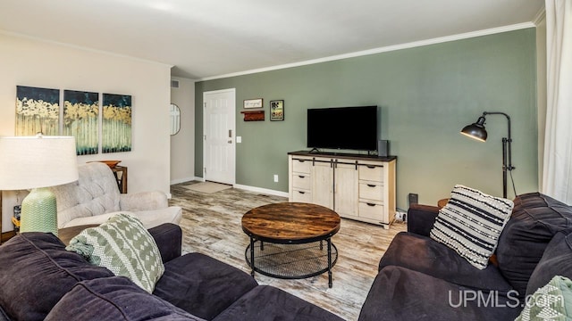 living room with hardwood / wood-style flooring and crown molding