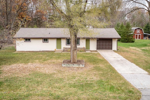 ranch-style house with a front lawn and a garage