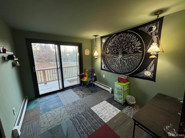 doorway to outside featuring a baseboard heating unit and carpet