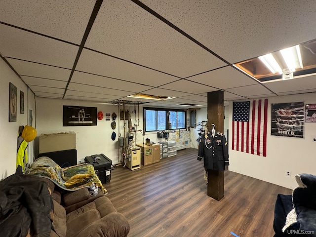 interior space featuring dark wood-type flooring and a paneled ceiling