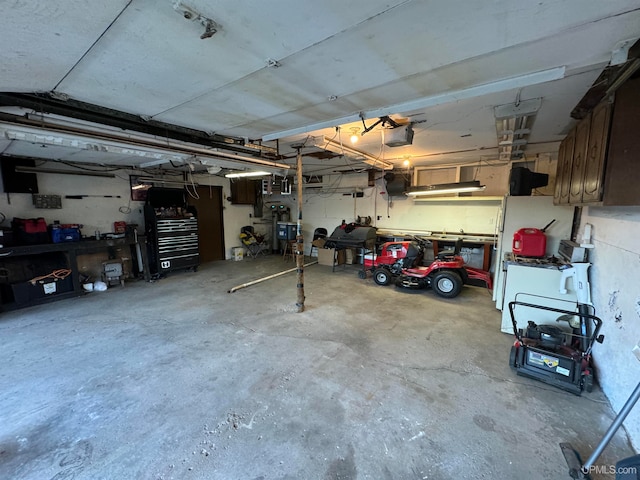 garage featuring a workshop area and a garage door opener