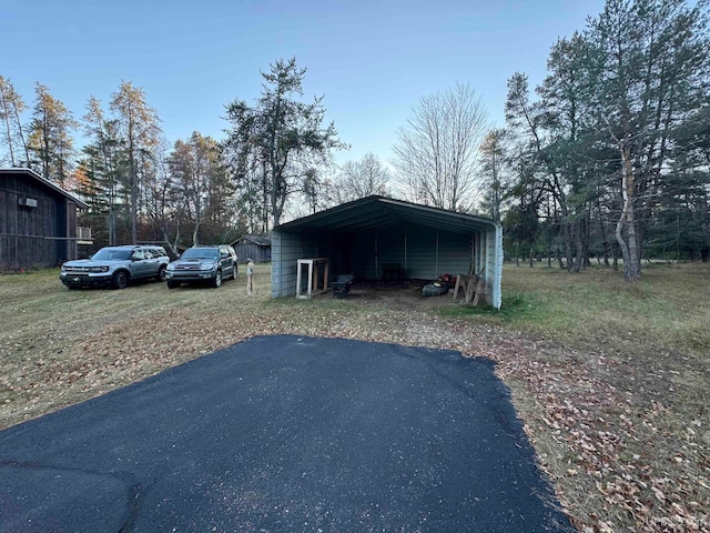 view of outbuilding with a carport