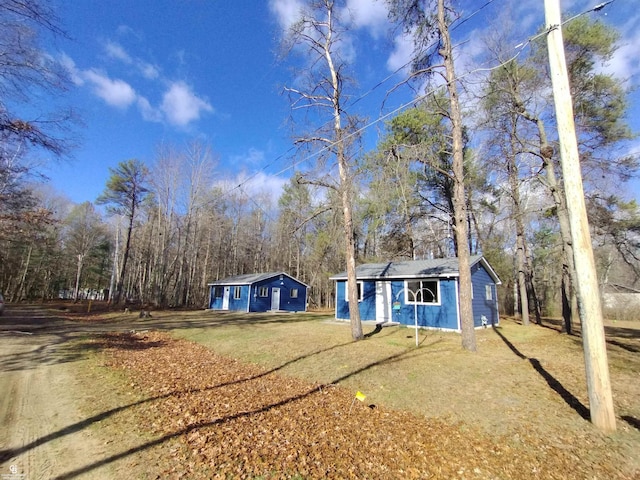 exterior space featuring a front lawn